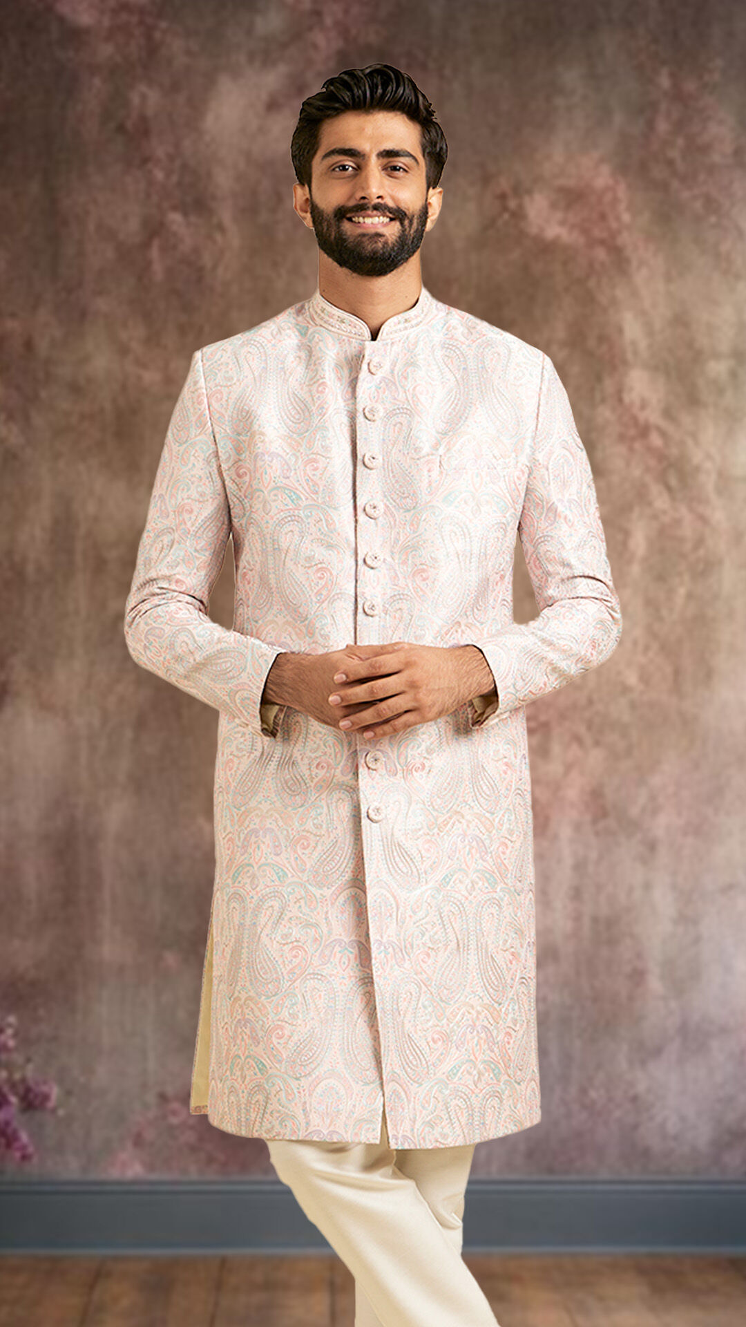 A man wearing pink sherwani for daytime events